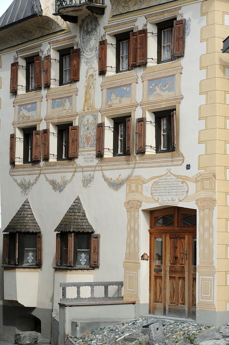 Decorated facade of three-storey building in Val Sinestra in Graubuenden canton, Switzerland
