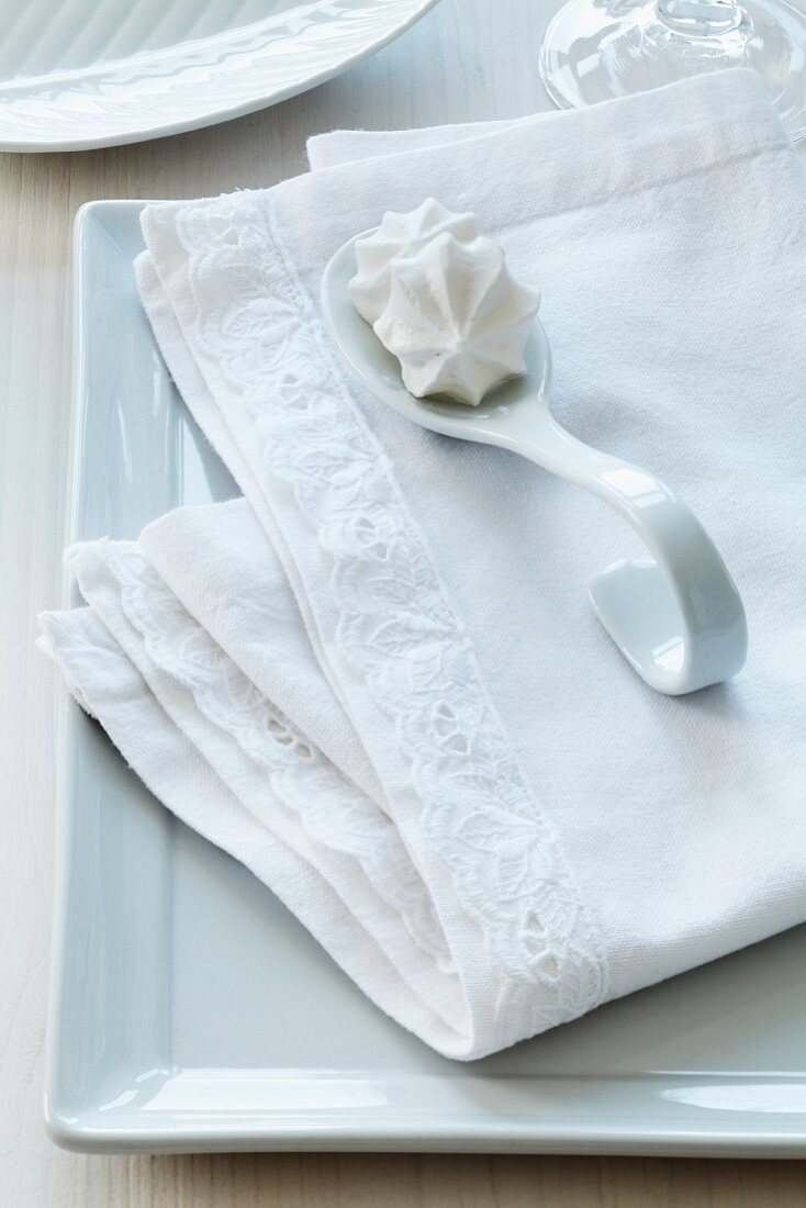Linen napkin with hand-sewn, appliqué lace trim