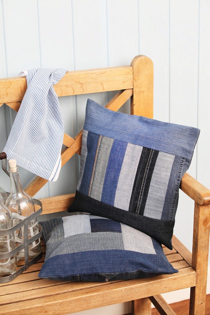 Hand-sewn, patchwork scatter cushions on wooden bench