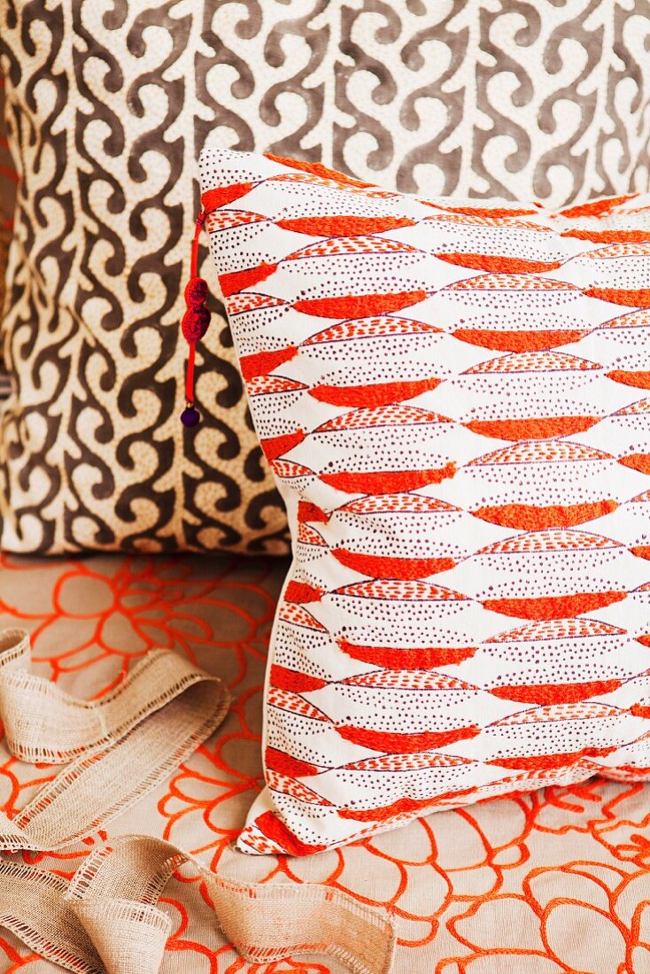 Cushions with various, bright orange patterns