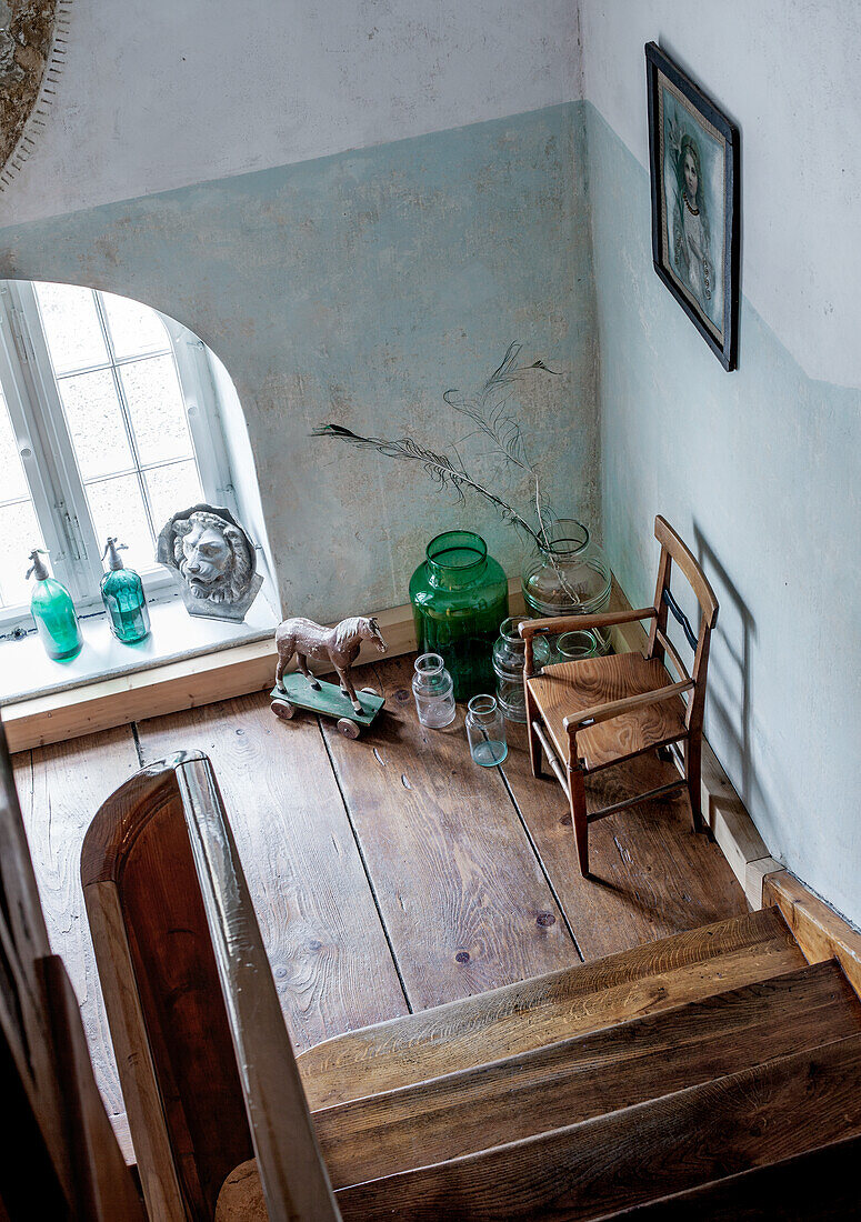 View of level with vintage decoration from wooden staircase