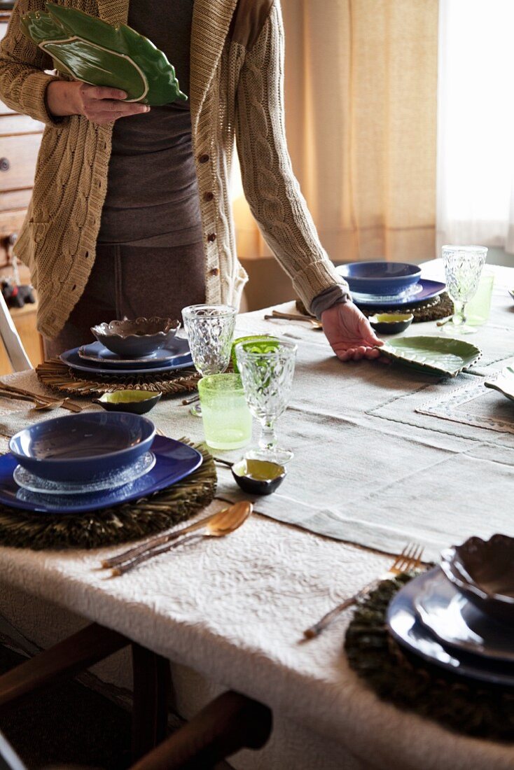 Woman setting a table