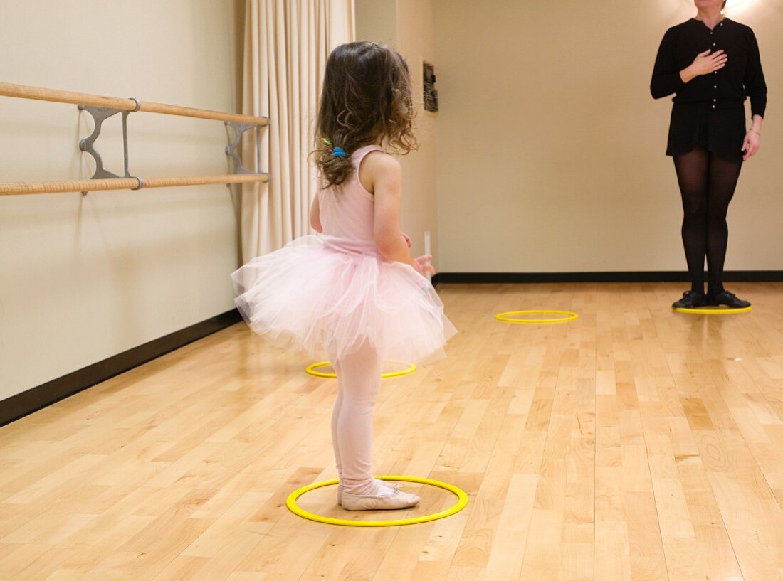 Small girl gets ballet lesson