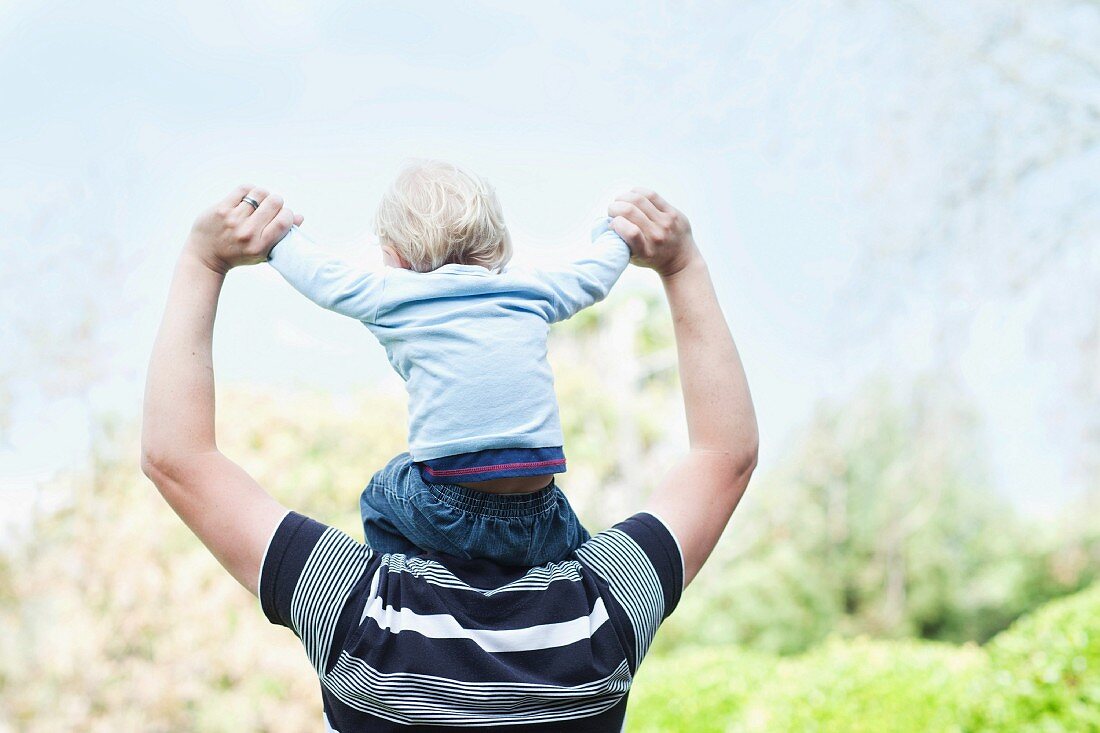 Father with baby son on shoulders