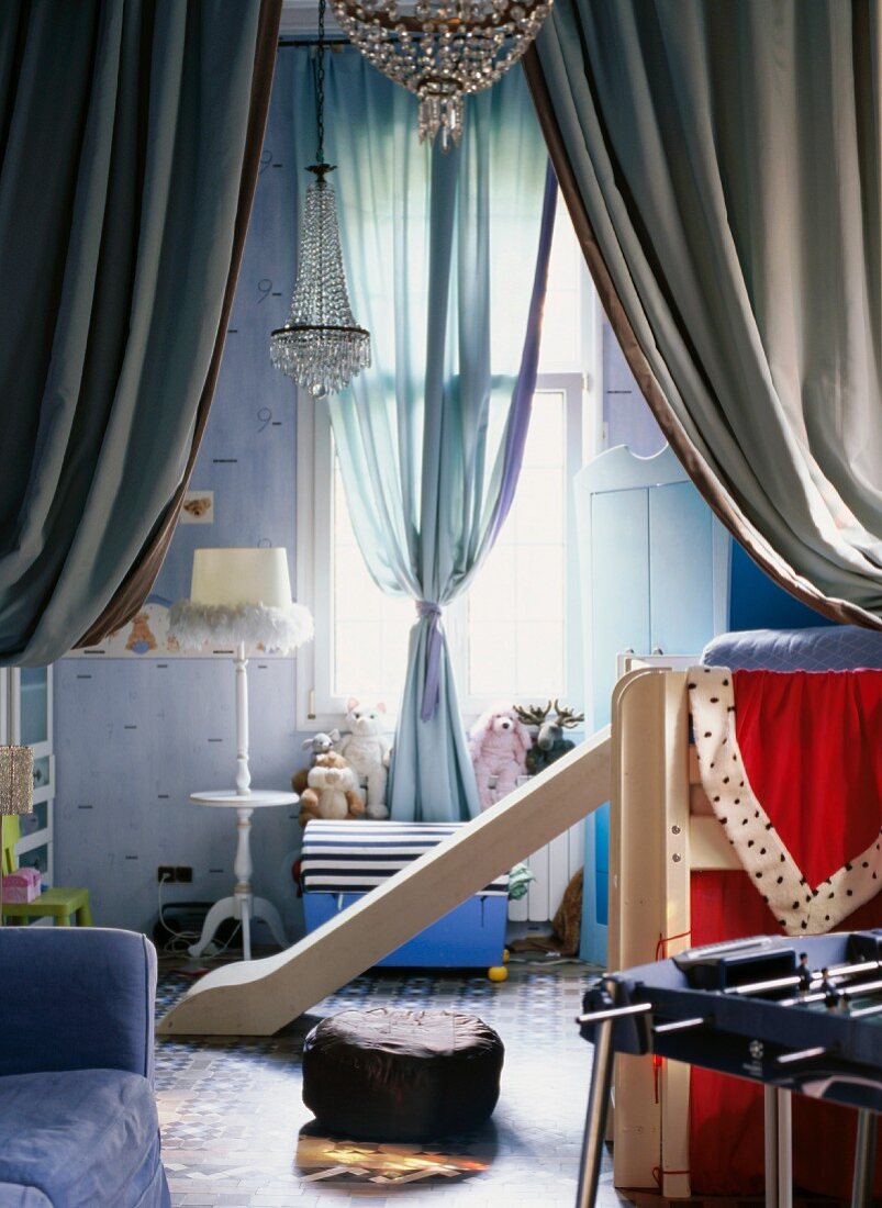 Modern loft bed with slide in grandiose child's bedroom with chandelier