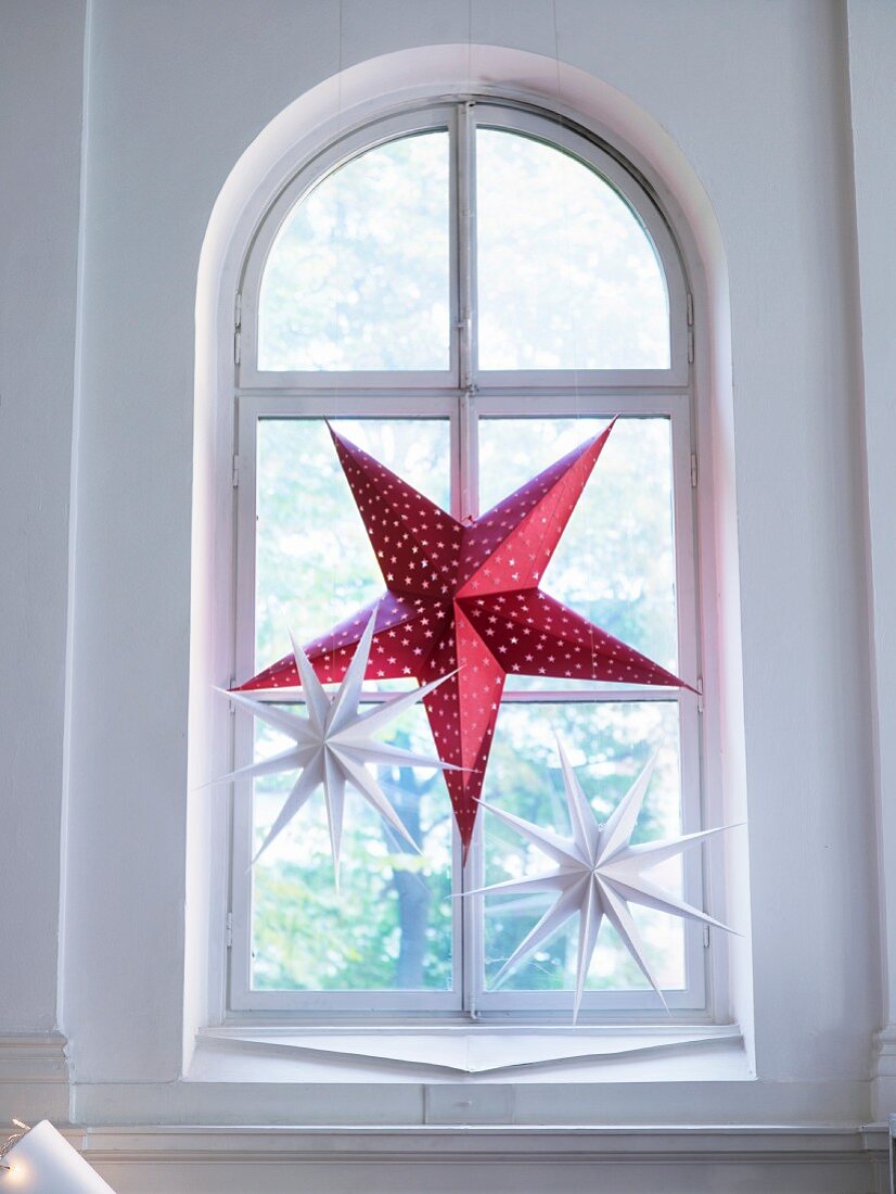 Advent star in arched window