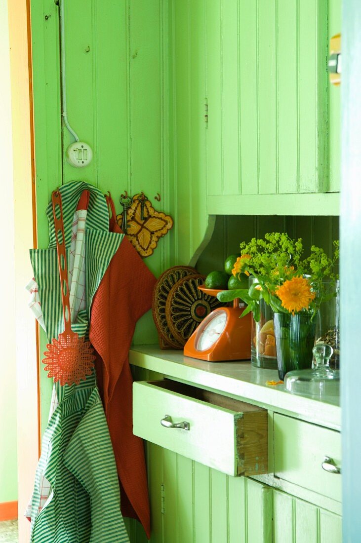 Green wooden kitchen cupboards