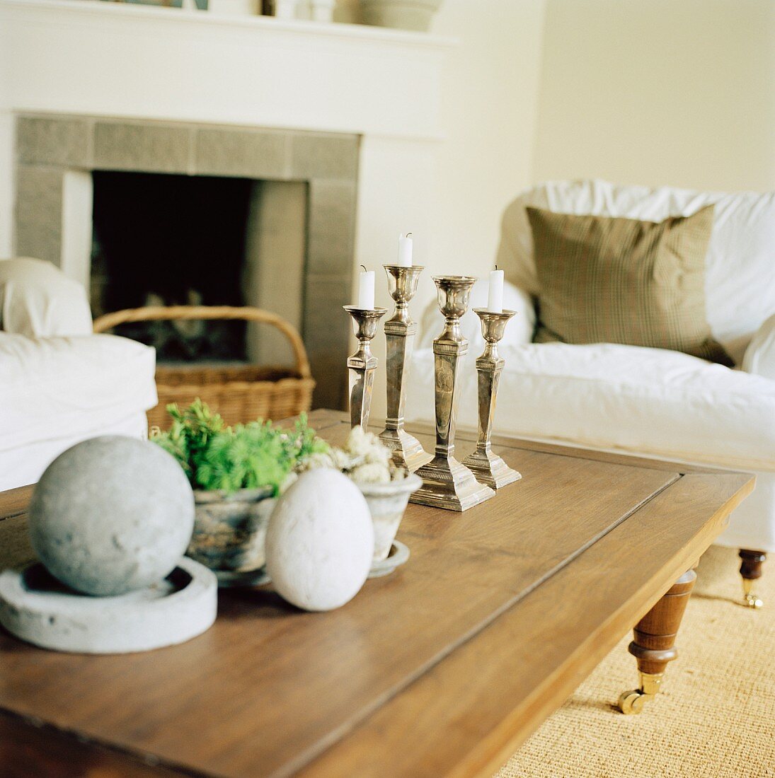 Stone ornaments & candlesticks on coffee table