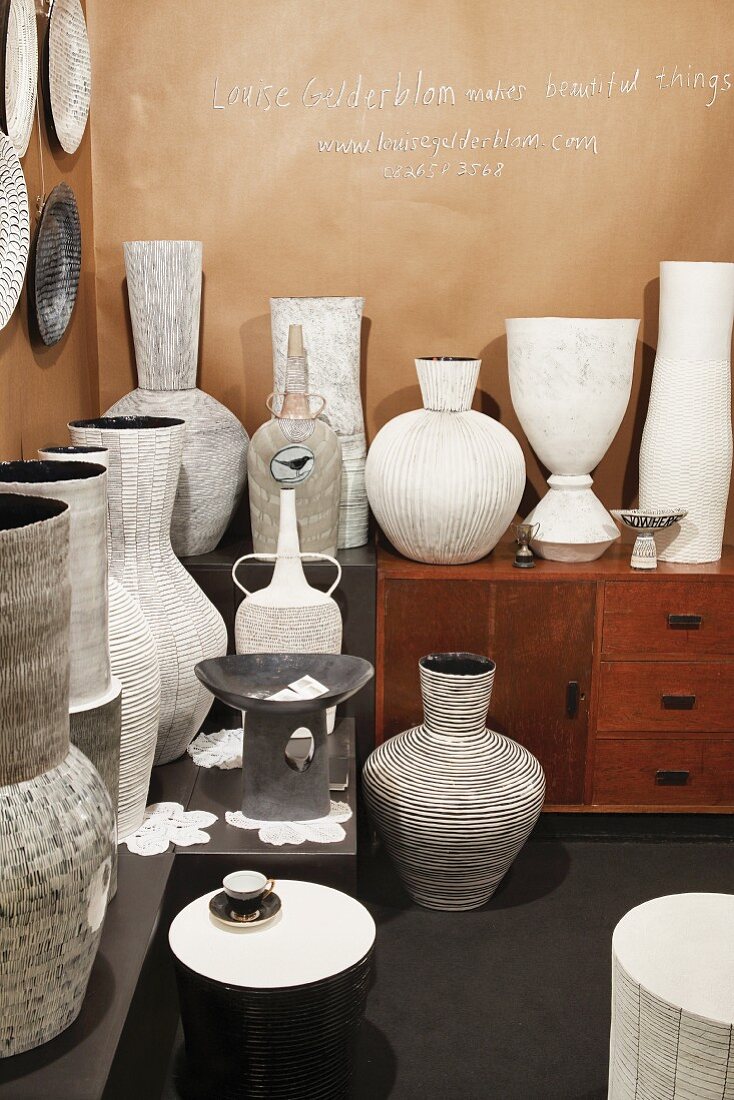 Hand-thrown, pale ceramic vases with embossed patterns