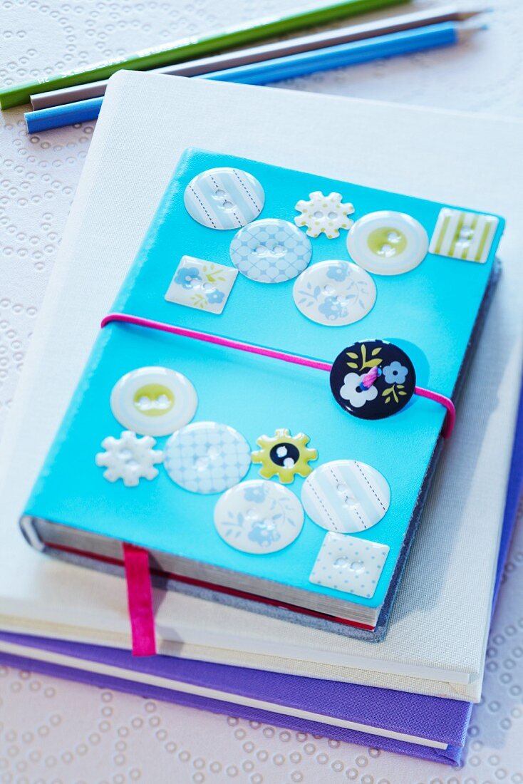 Notebook decorated with buttons