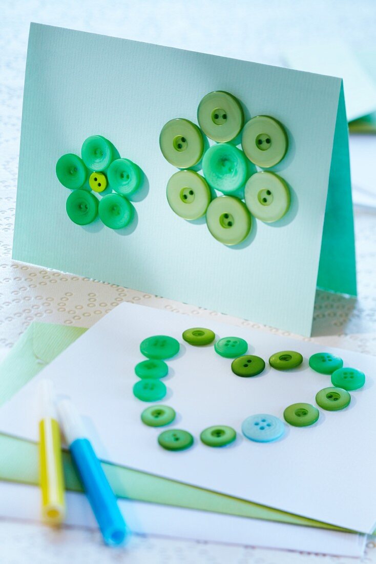 Invitation cards decorated with buttons