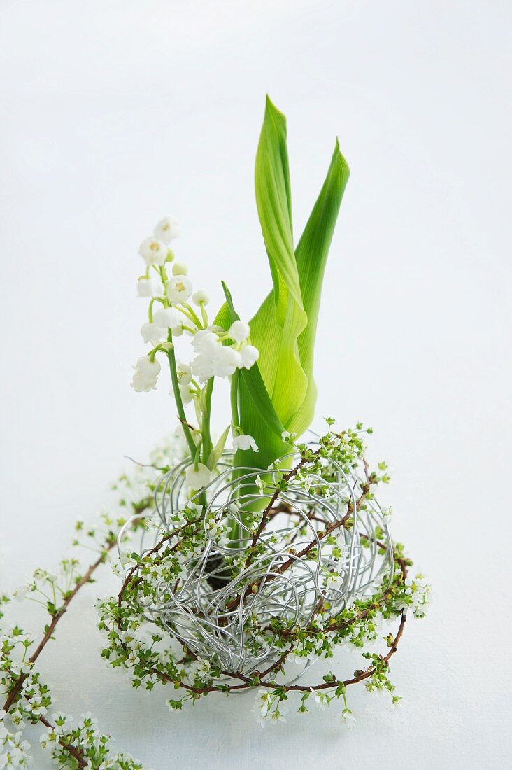 Lily of the valley & spiraea in ball of aluminium wire