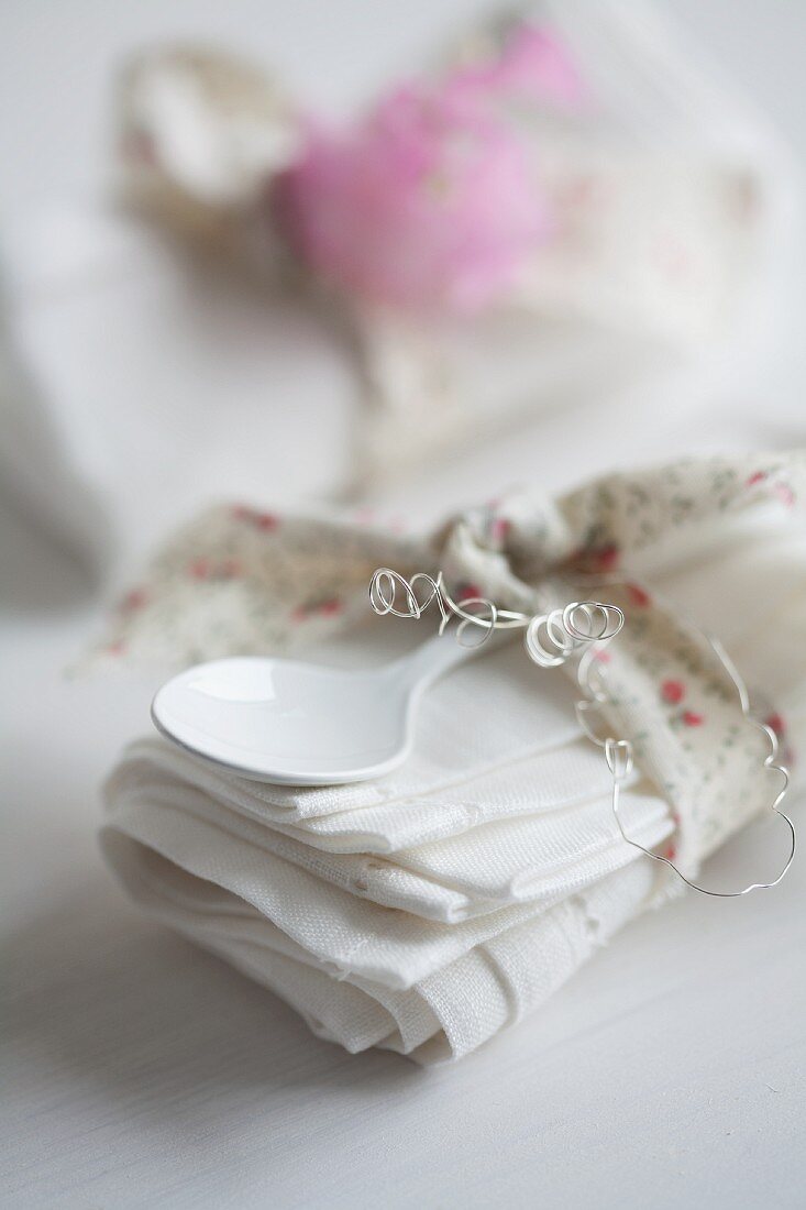 Linen napkin & spoon wrapped in ribbon