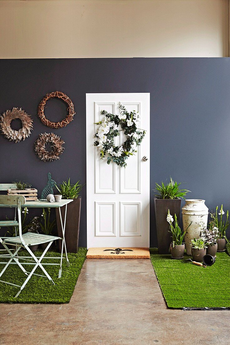Various decorative wreaths made of feathers, artificial flowers and wicker as wall and door decorations