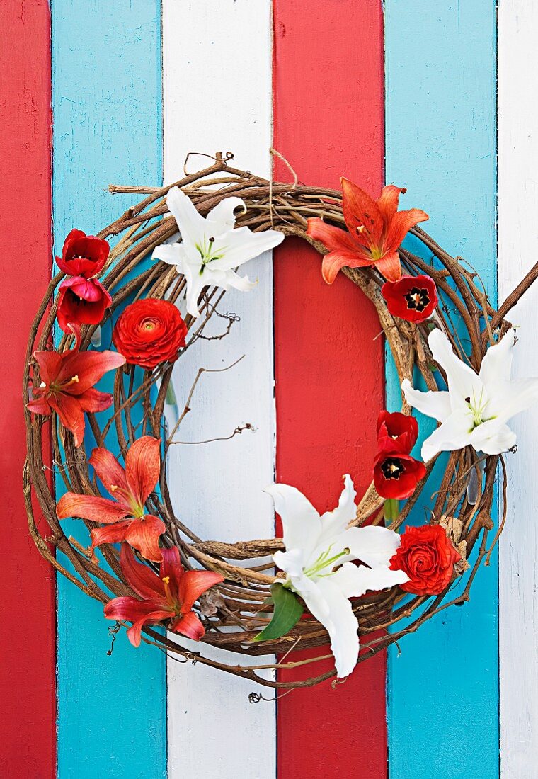 Door wreath hand-crafted from twigs, lilies, tulips & ranunculus