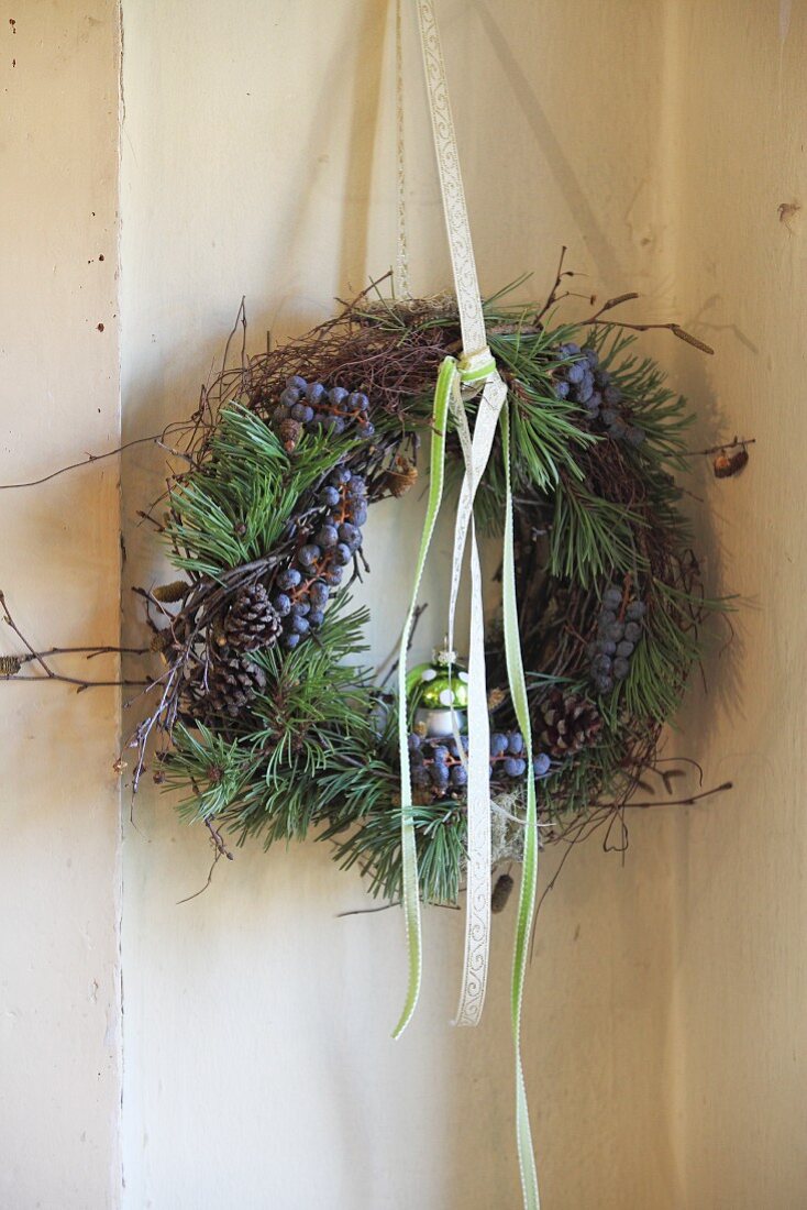Wreath of pine branches, cones and sloes