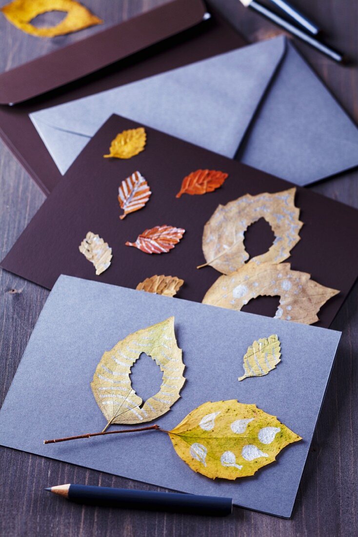 Invitation cards decorated with painted autumn leaves