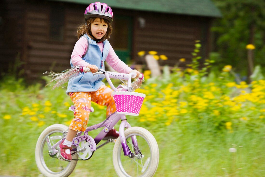 Portrait of girl riding bike
