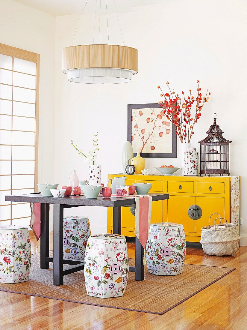 Dining room with Chinese elements and floral barrel stools
