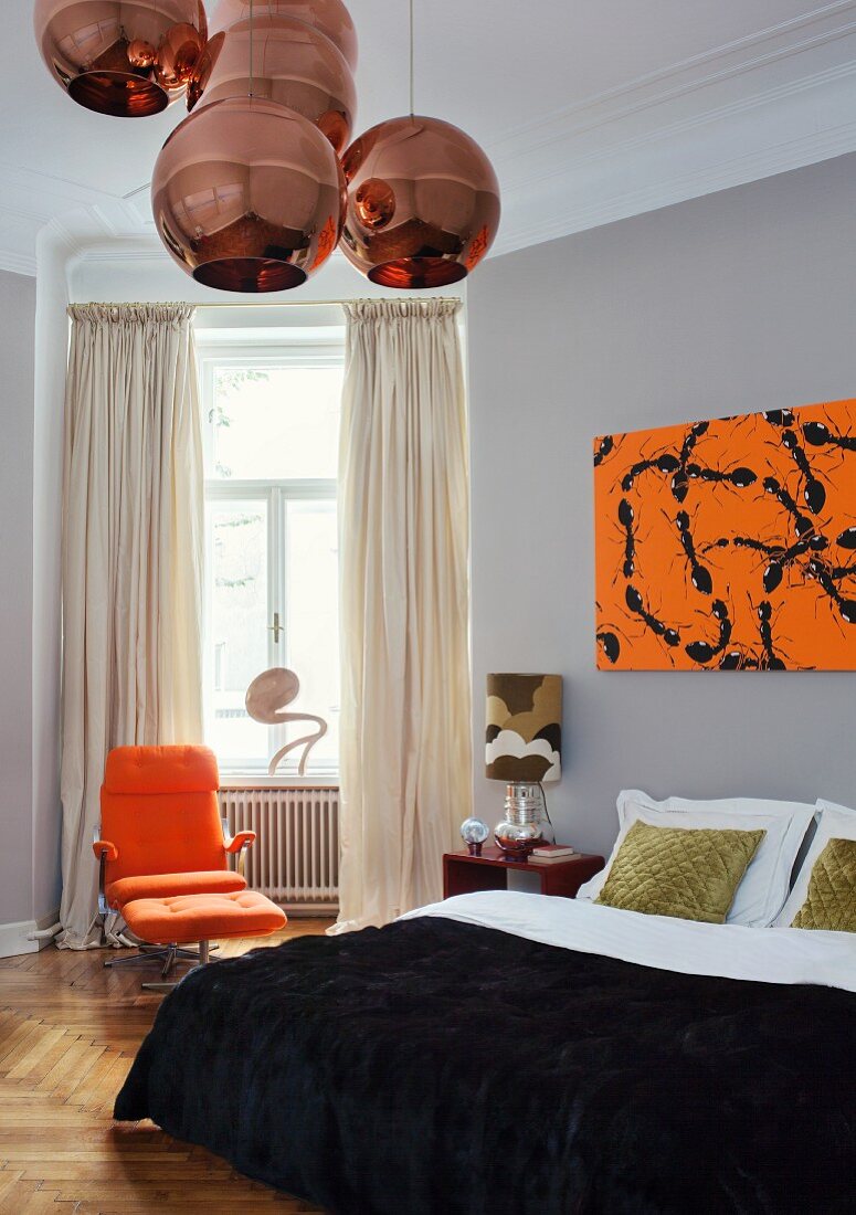 Copper Shade pendant lamps in artistic, retro bedroom with modern artwork above elegant double bed