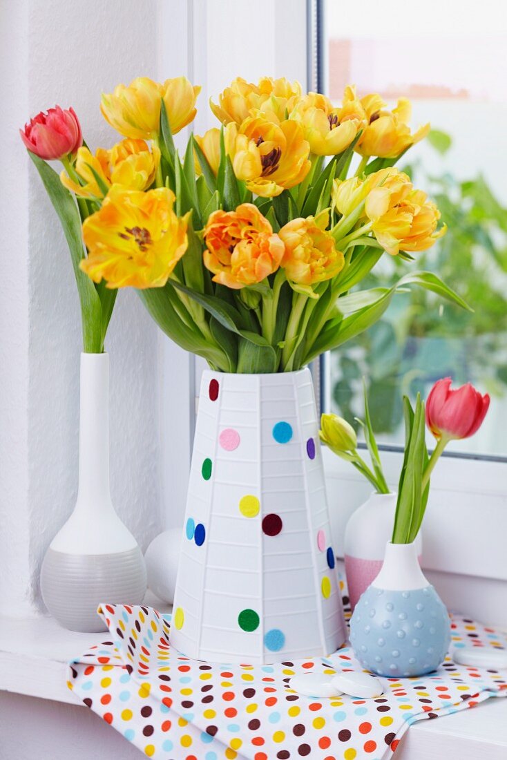 Tulips in vase decorated with felt confetti