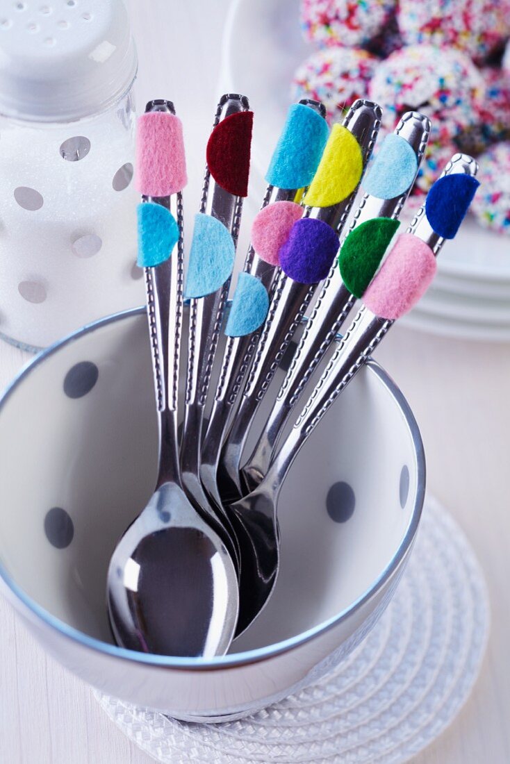 Cutlery with felt confetti stuck on handles