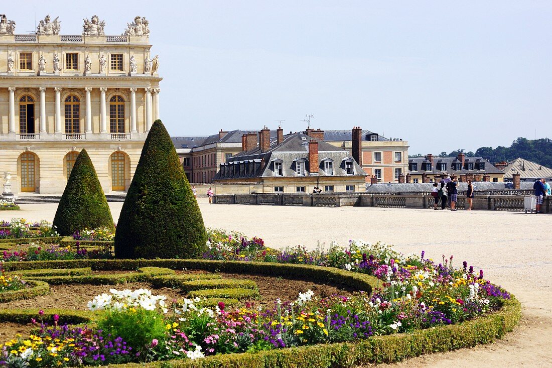 Low hedges around landscaped, Baroque flower beds in the park of the Palace of Versailles