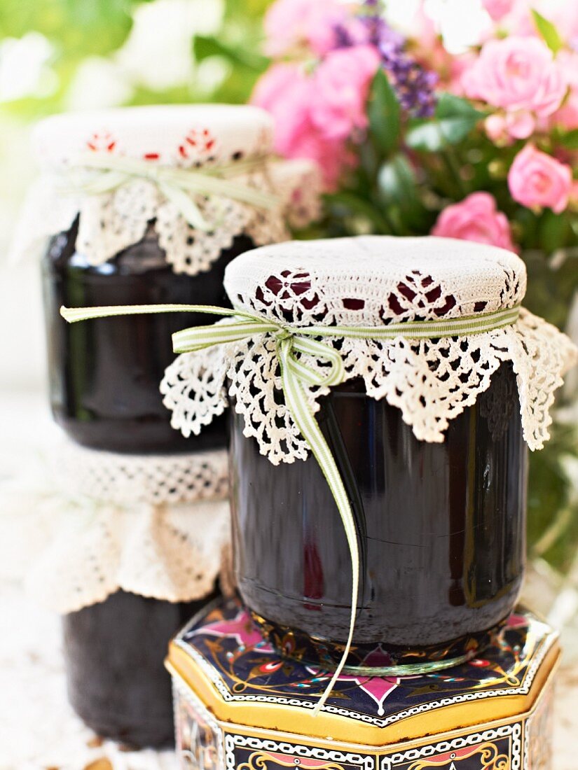 Jars of bilberry jam with lace covers