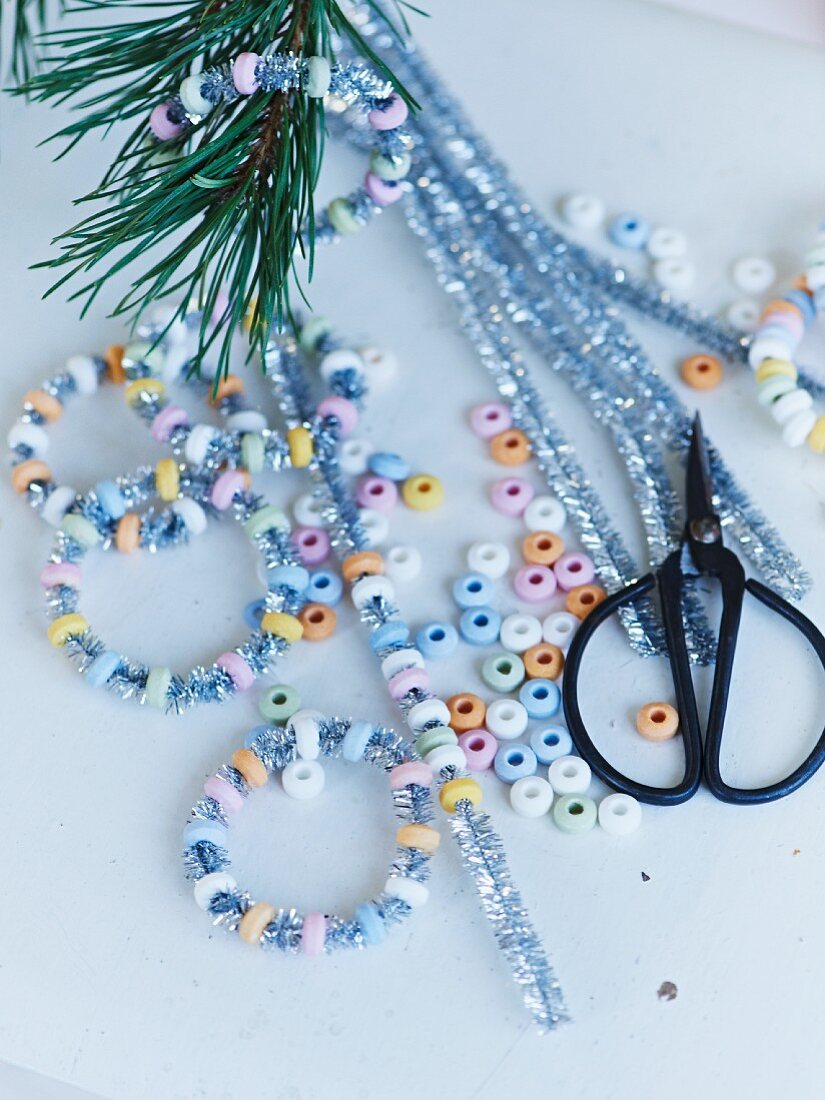 Hand-crafting glittery, sugar-bead hoops for Christmas tree