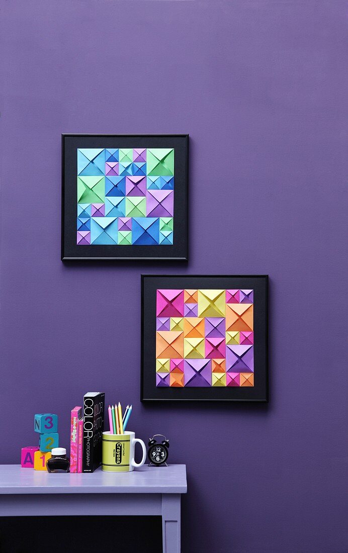 Two frames 3D-effect pictures in op art style made from squares of colourful origami paper