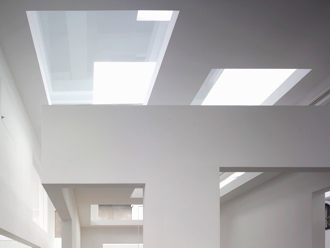 Contemporary architecture with glass covered cut-outs in a ceiling