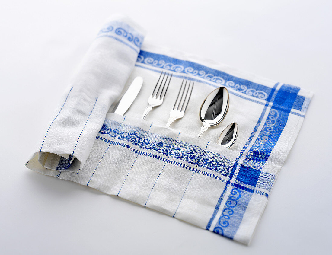 A cutlery bag made from an old tea towel