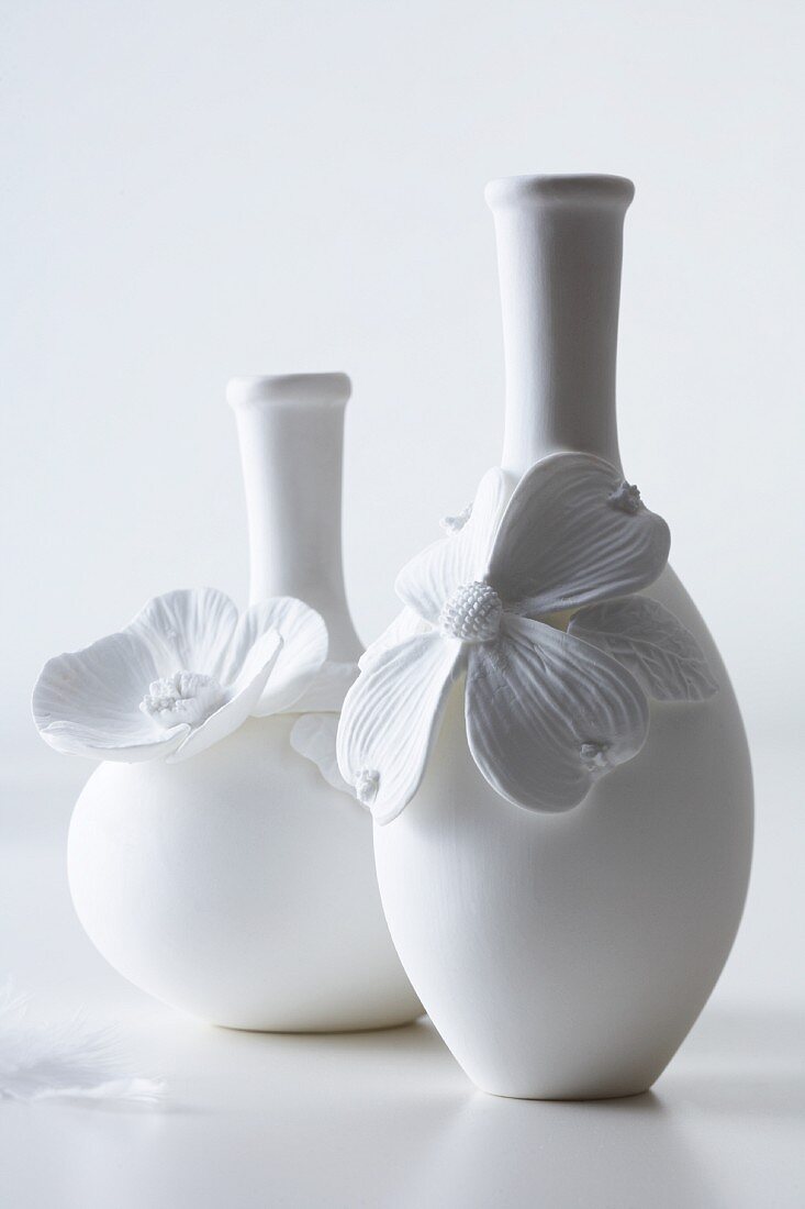 White vases decorated with flowers