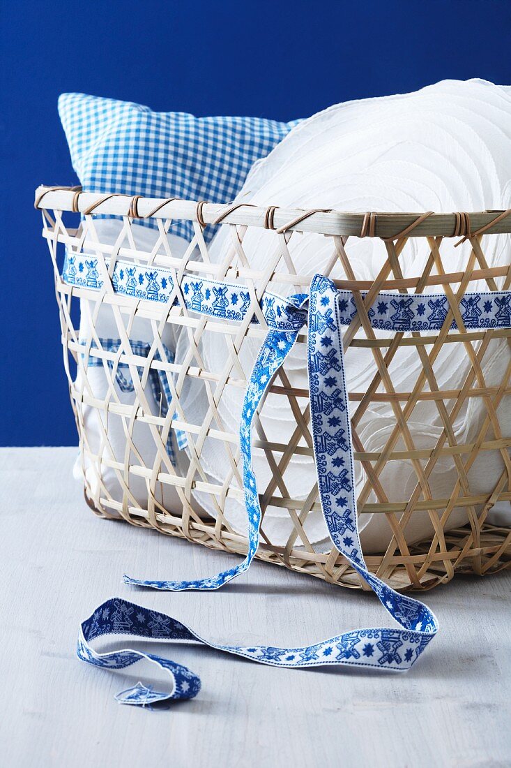 Basket with a pillow and a ribbon