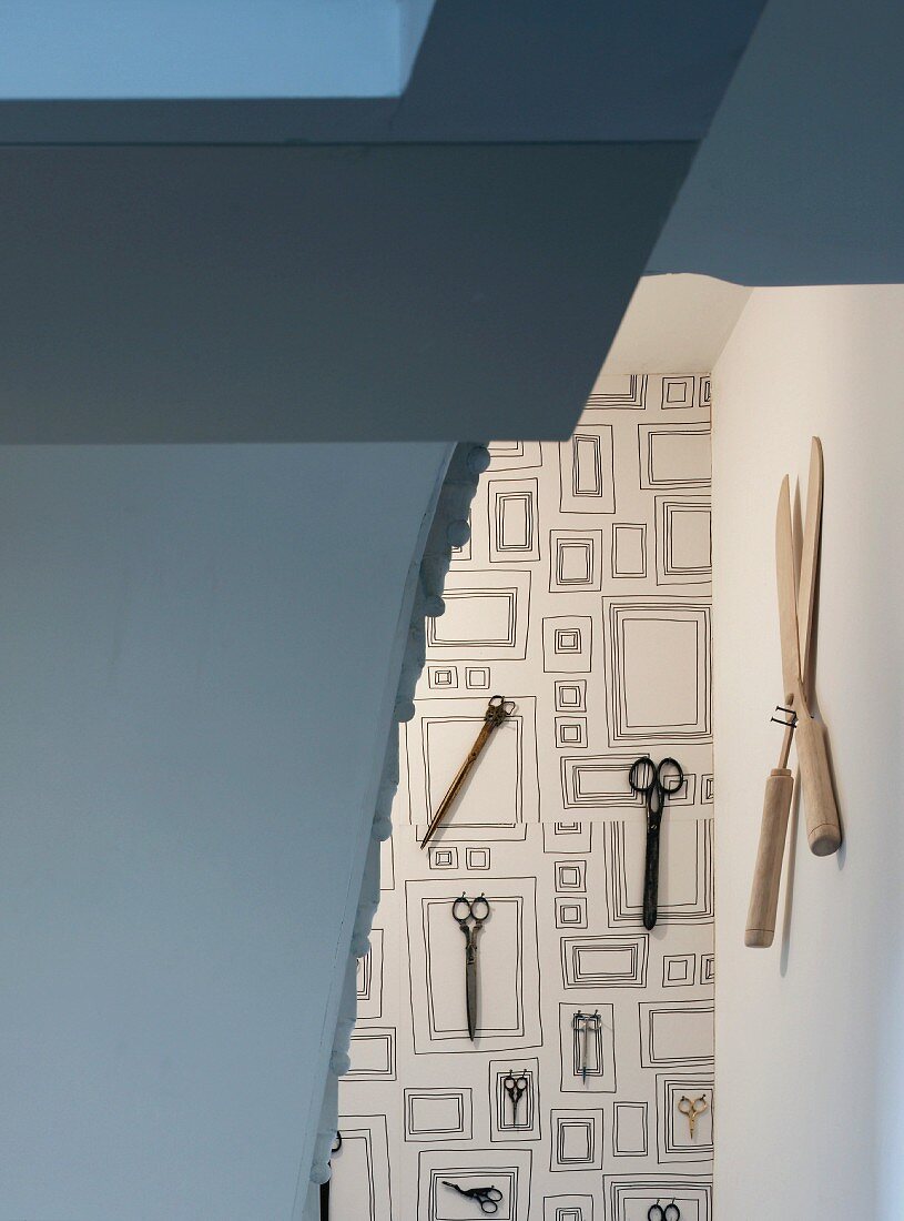 Collection of scissors on wallpaper with rectangular pattern