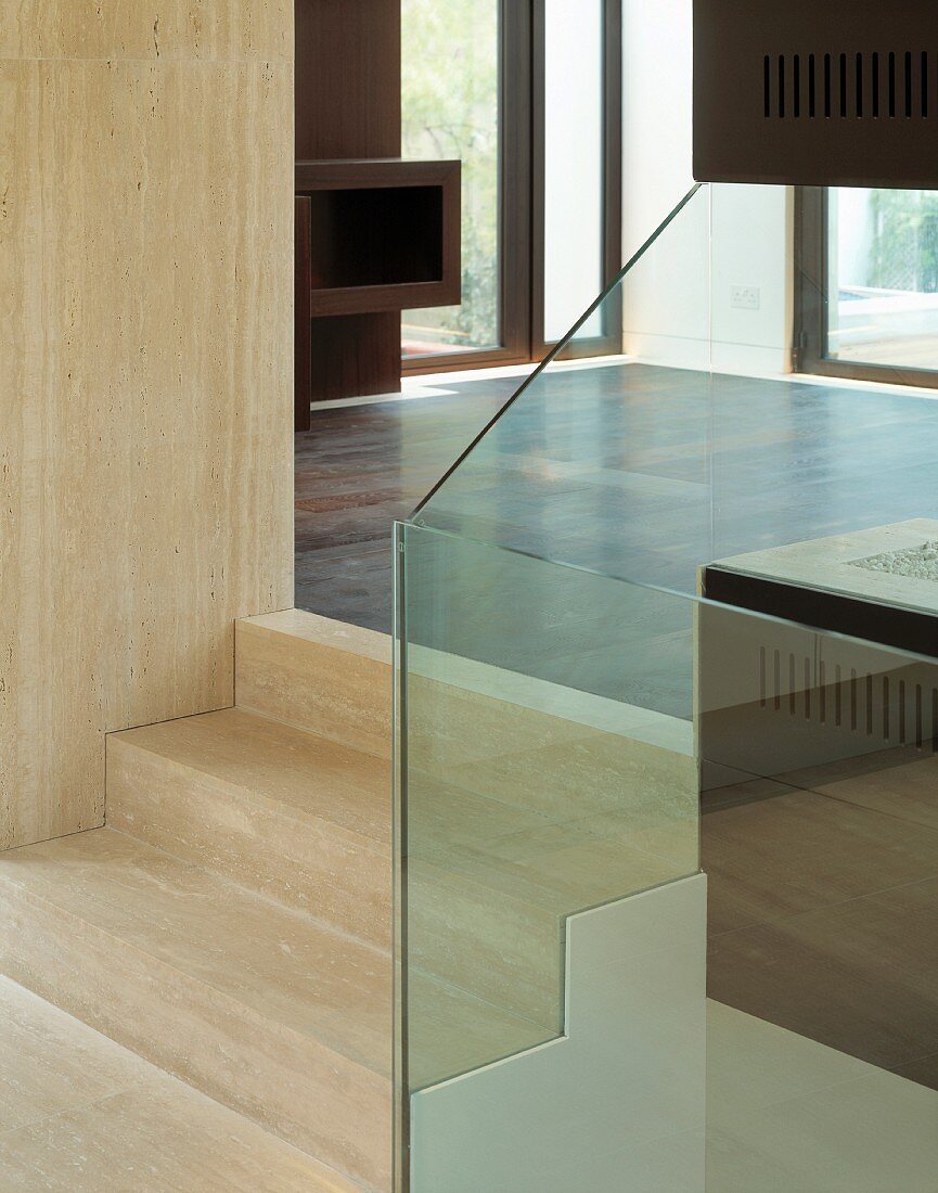 Stone steps with glass panel balustrade
