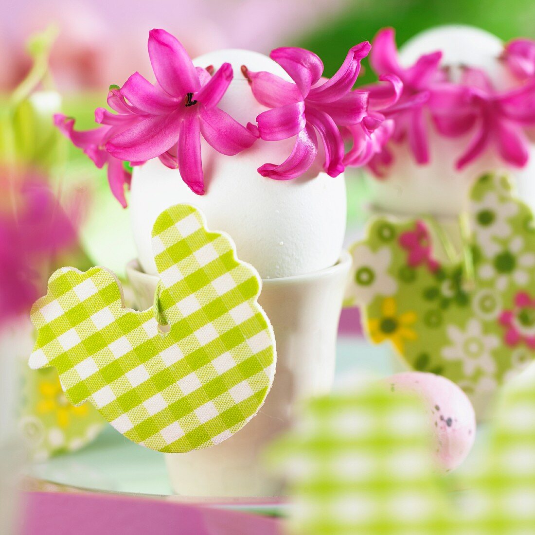 Eggs in egg cups decorated with hyacinth flowers