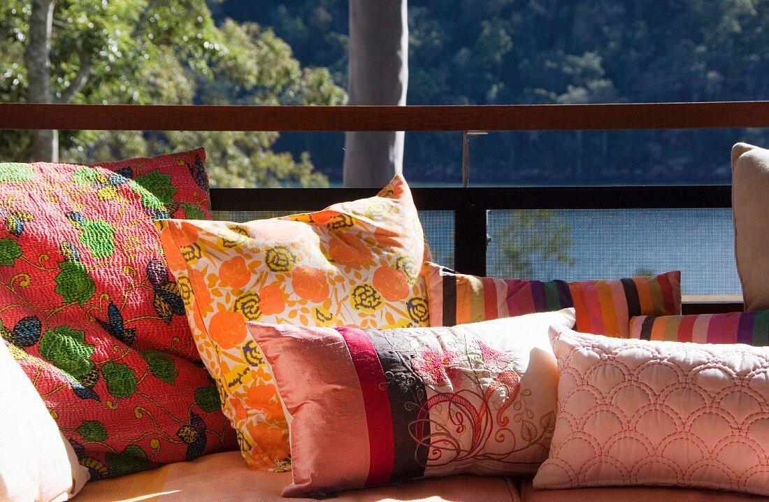 Scatter cushions on sofa on terrace