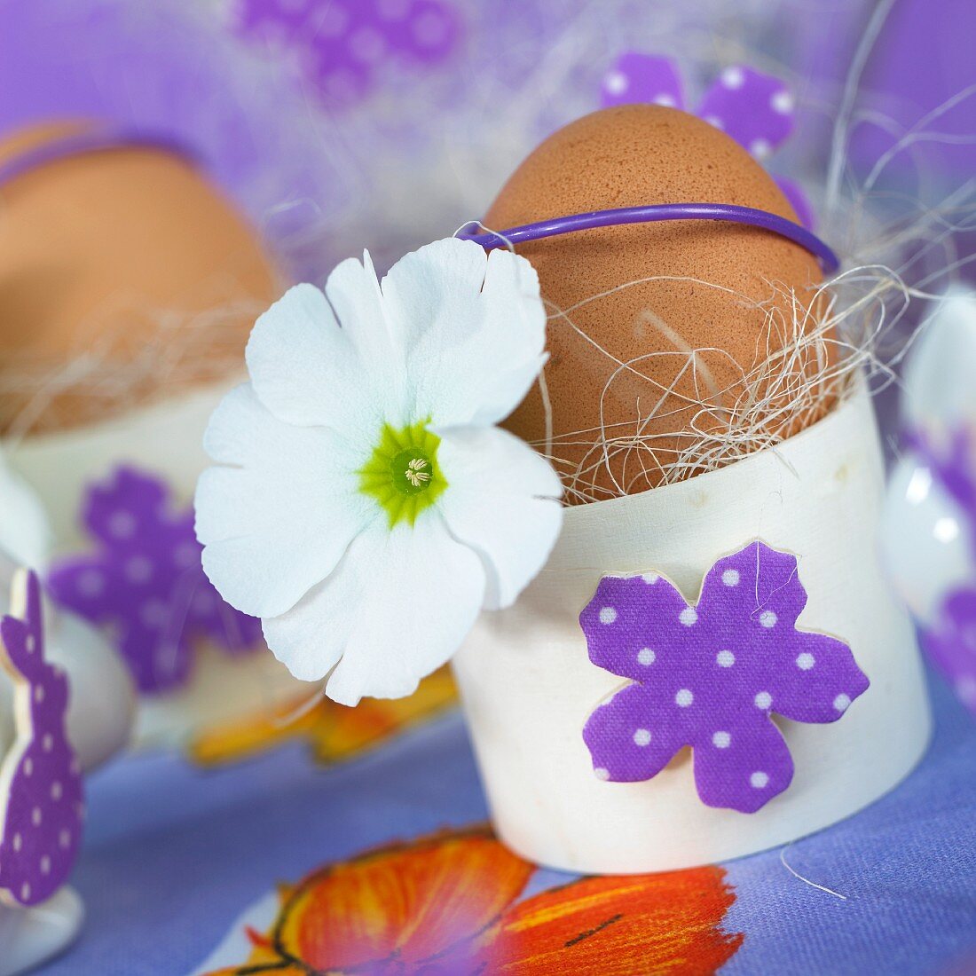 Easter eggs in decorated egg cups