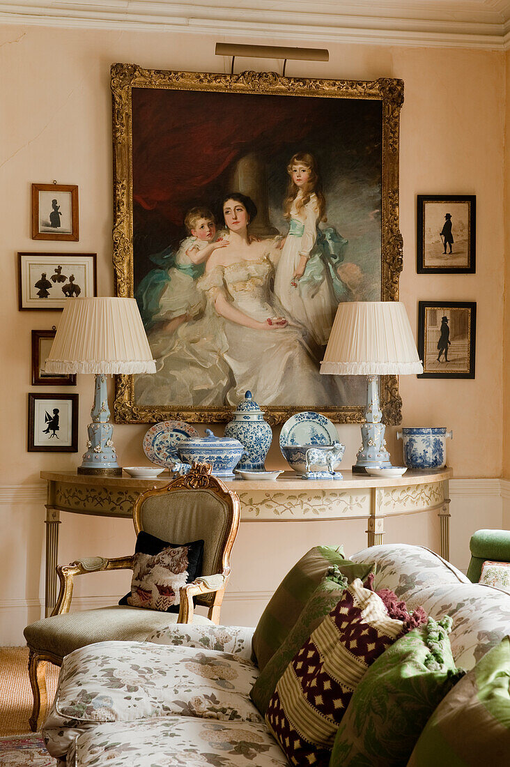 Living room with classical painting, antique furniture and blue porcelain crockery