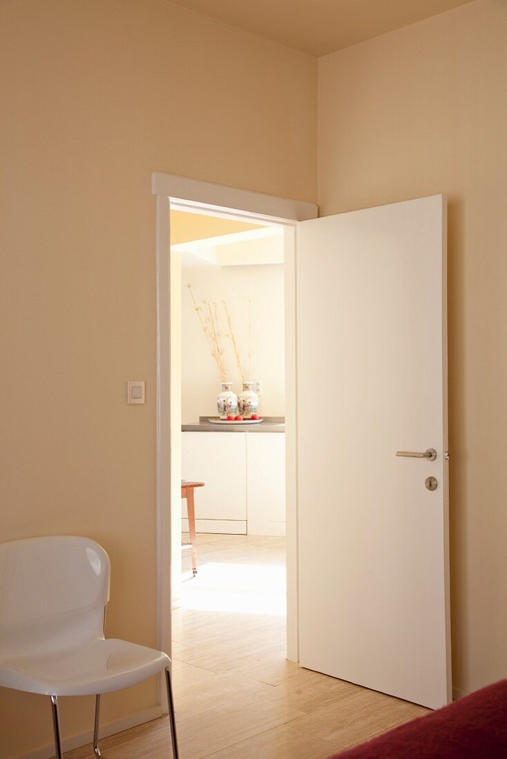 View from bedroom into kitchen through open door