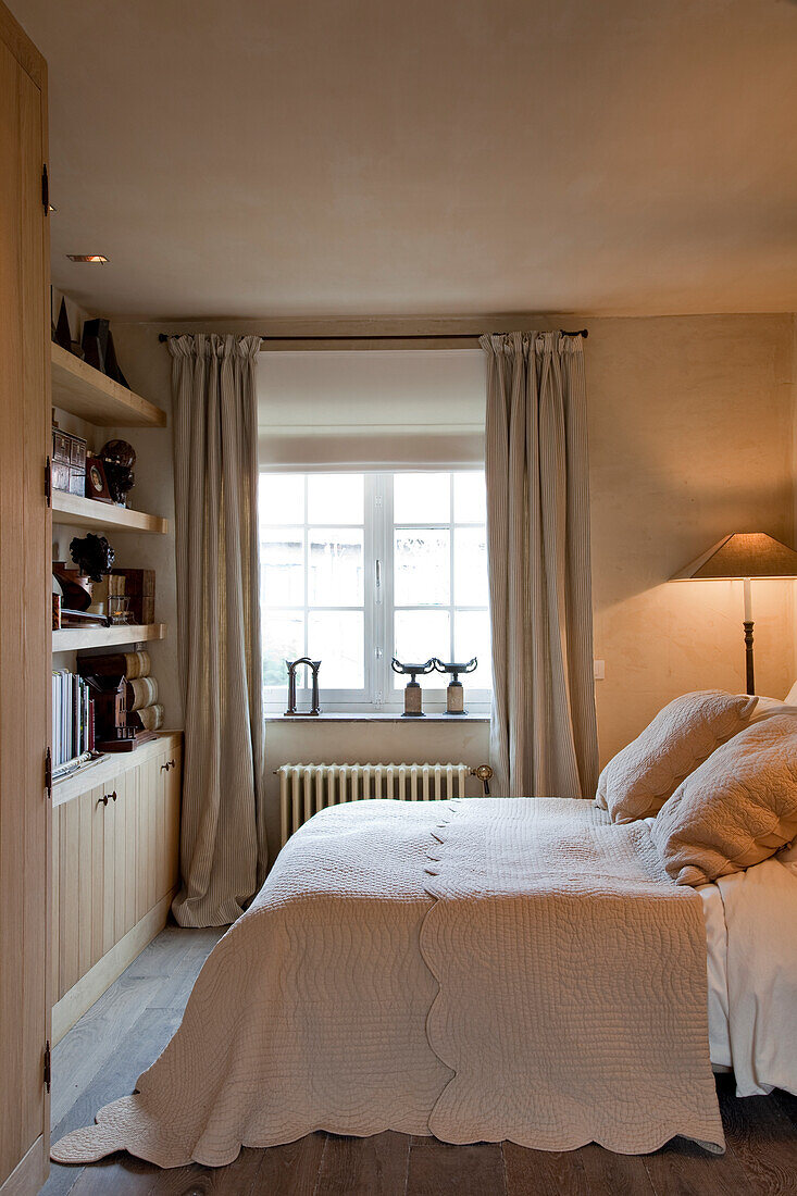 Simple, pale bedroom in rustic style