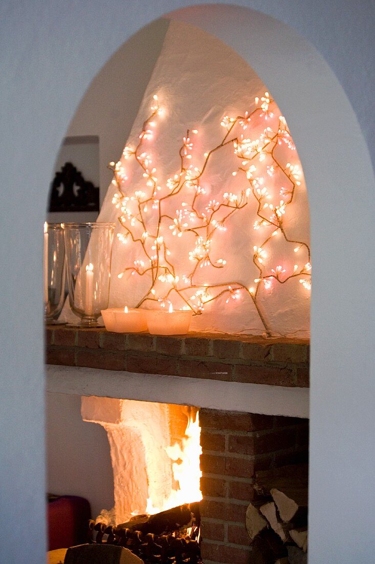 A fireplace room decorated for Christmas