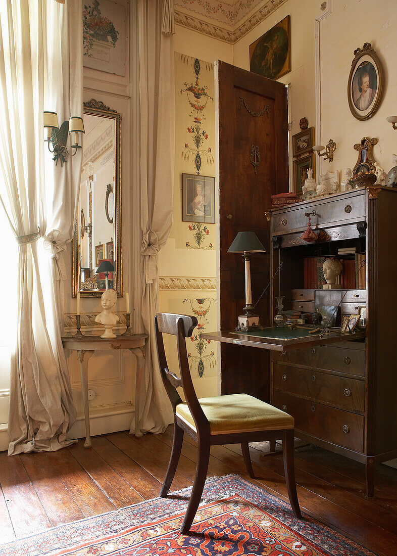 Study with antique furniture and oriental carpet