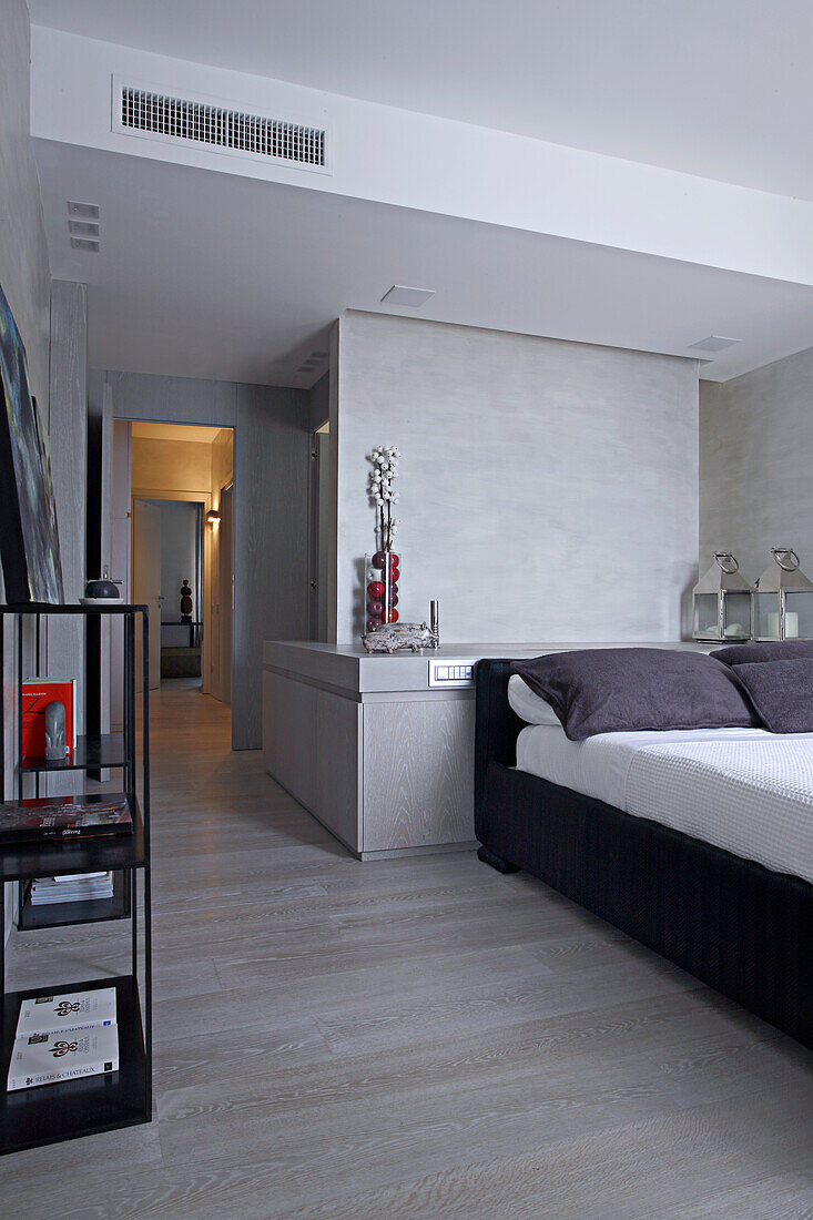 Minimalist bedroom with grey walls