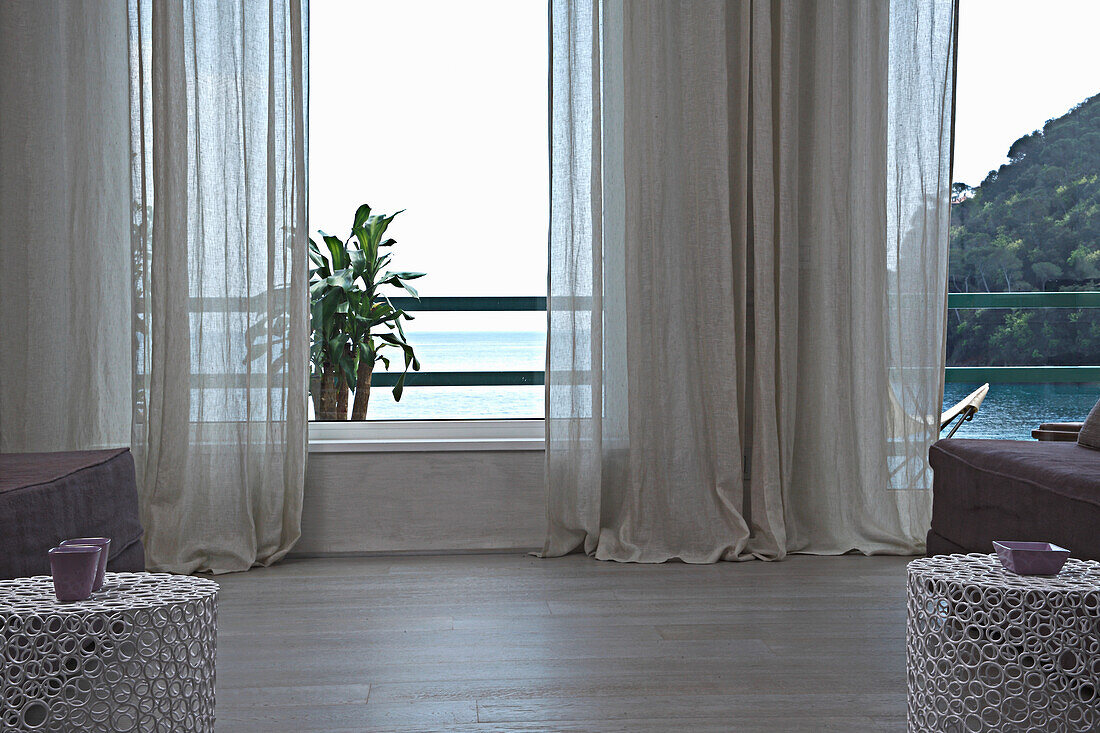 Living room with sea view and curtains