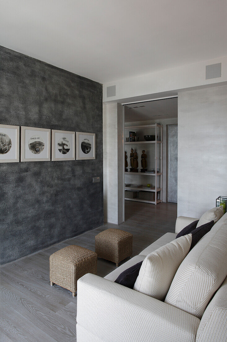 Living room with grey wall design and pictures