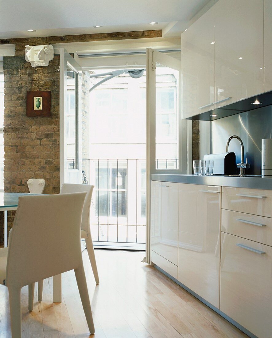 Detail of kitchen with dining area in modernised living space