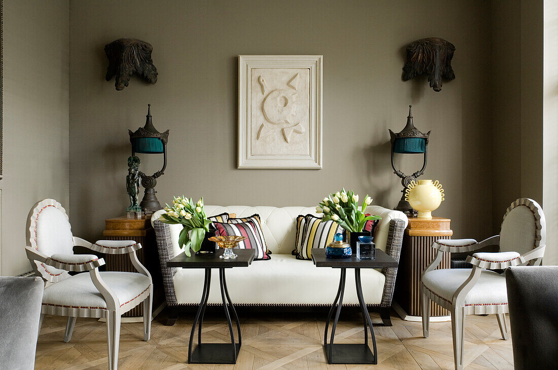 Living room with classic sofa, decorative cushions and tulip arrangements