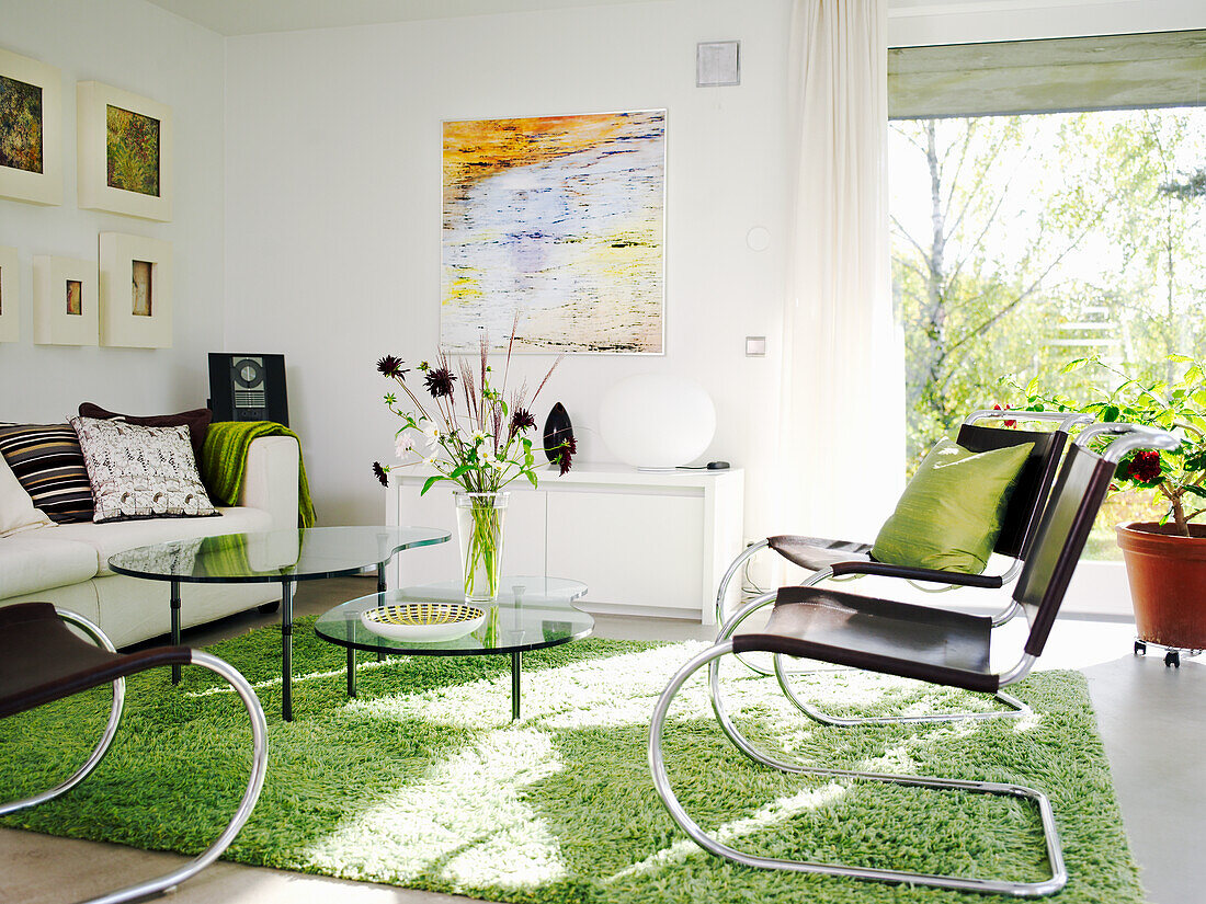 Bright living room with modern design and green accents